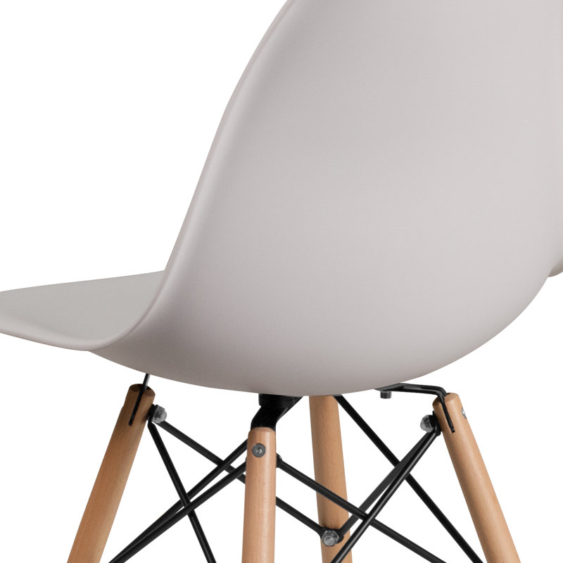 Wrought Studio™ Daker Plastic Side Chair with Wooden Legs by